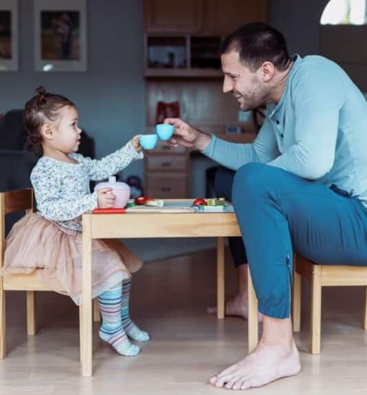 image of a dad and daughter having a tea party